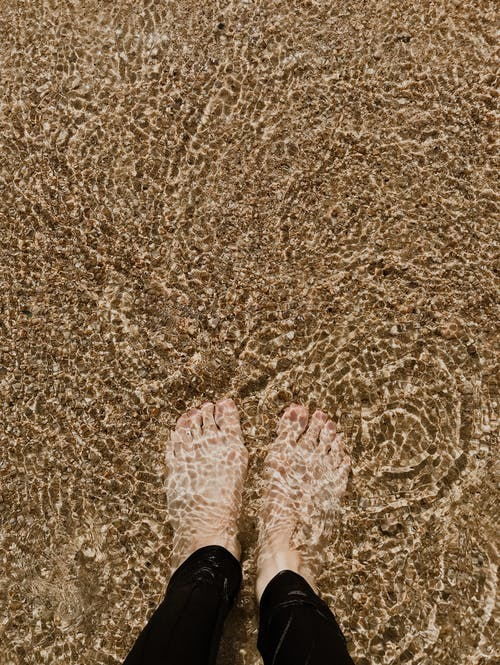 feet dipped in water