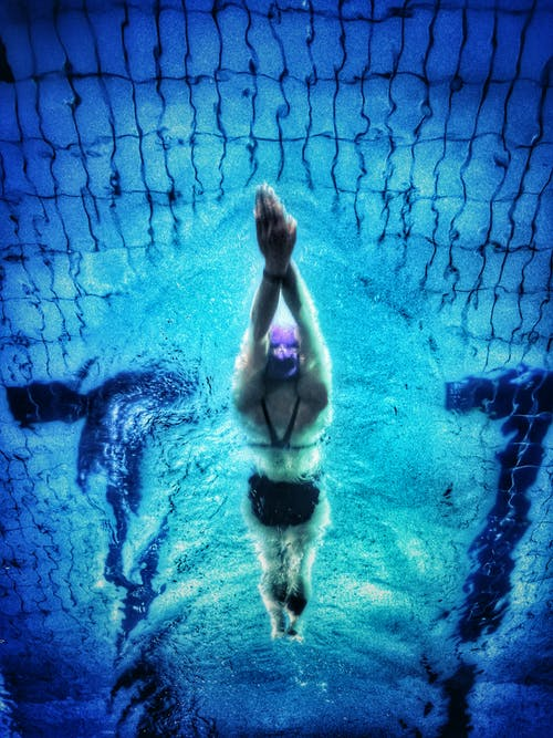 a woman relaxing while swimming in water