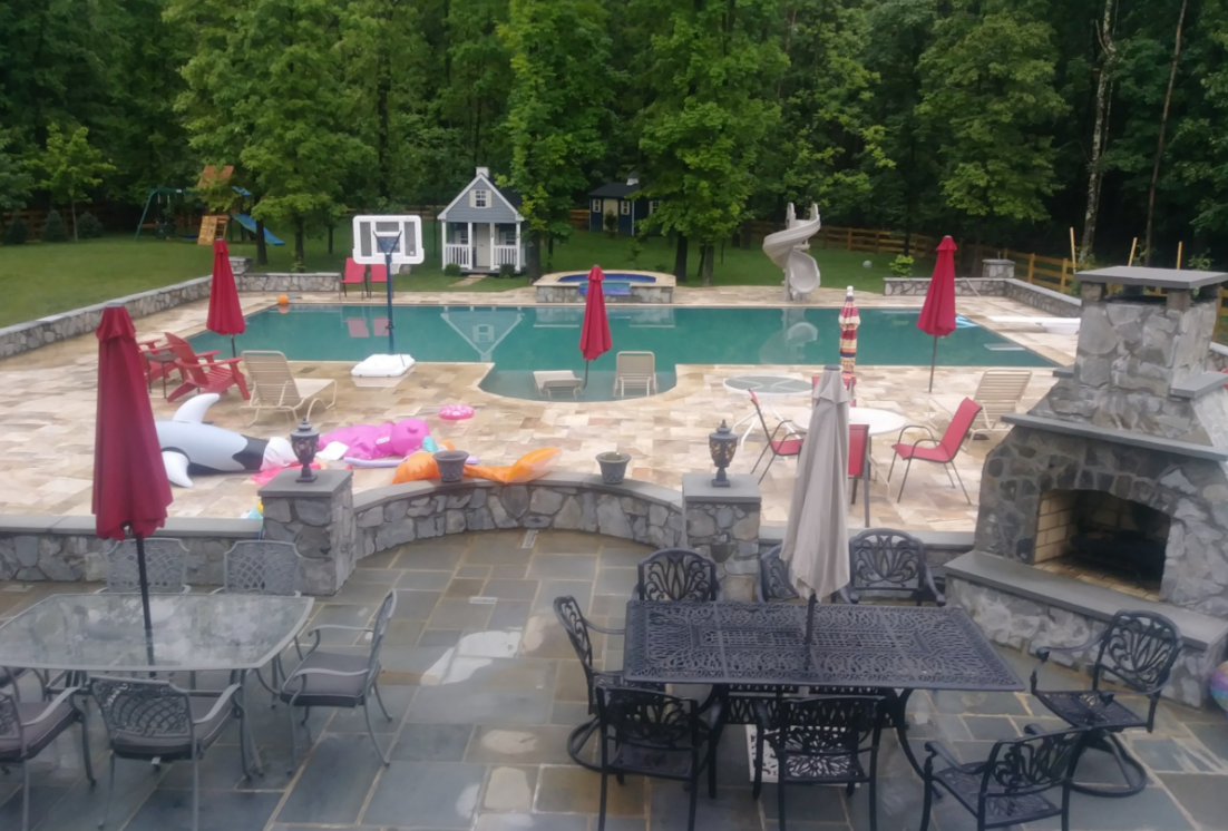 an outdoor living space with a pool