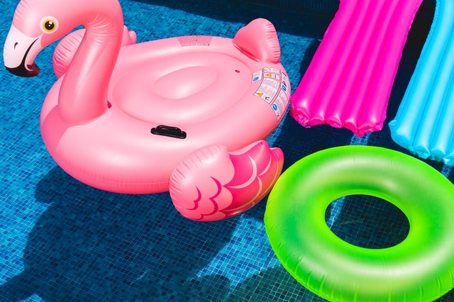 A unicorn-shaped and a round-shaped floatable.