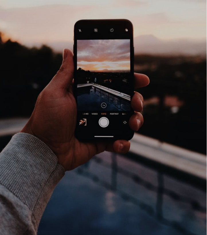 An individual taking a picture of a pool 