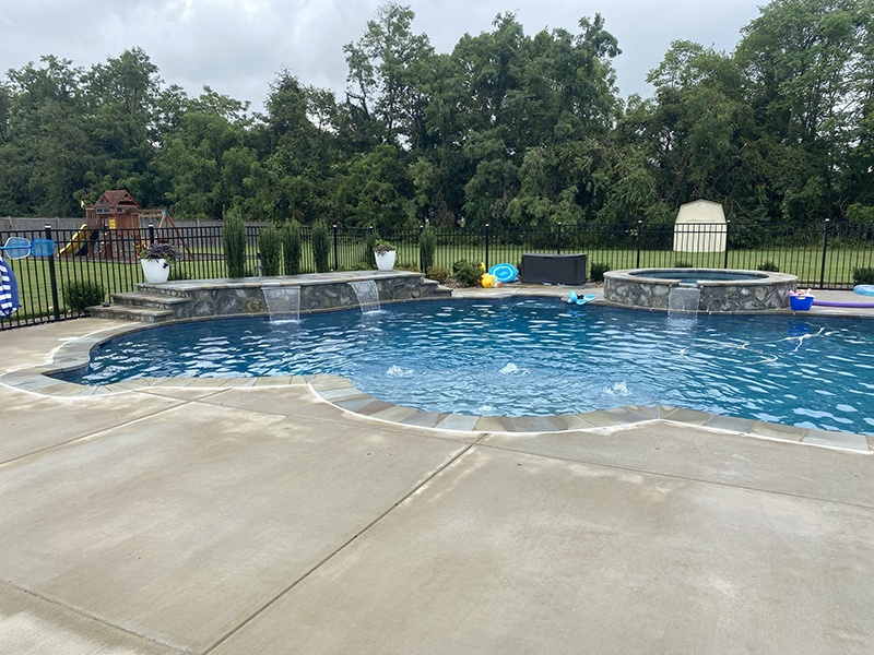 A beautiful outdoor landscape constructed by pool designers in Sterling.