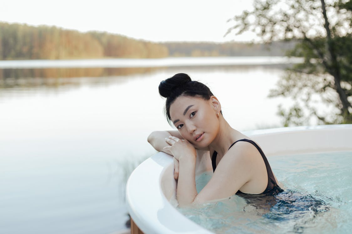 woman relaxing in a hot tub