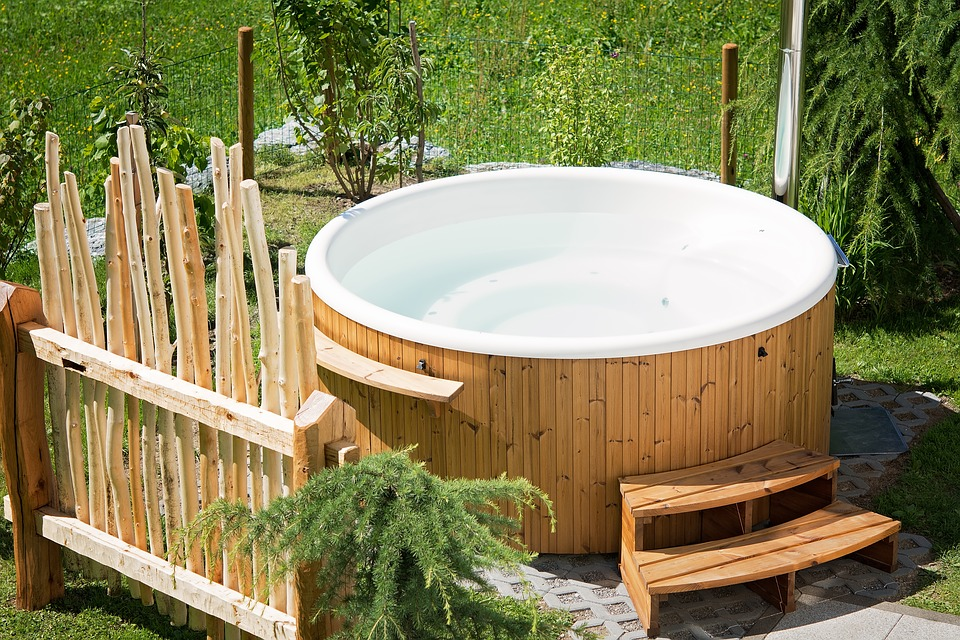 A garden with a wooden hot tub