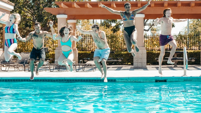 People jumping into the pool