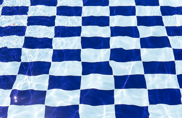 White and blue checkered design of the pool tiles