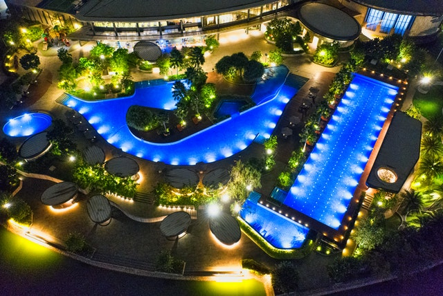  swimming-pools in various shapes at night