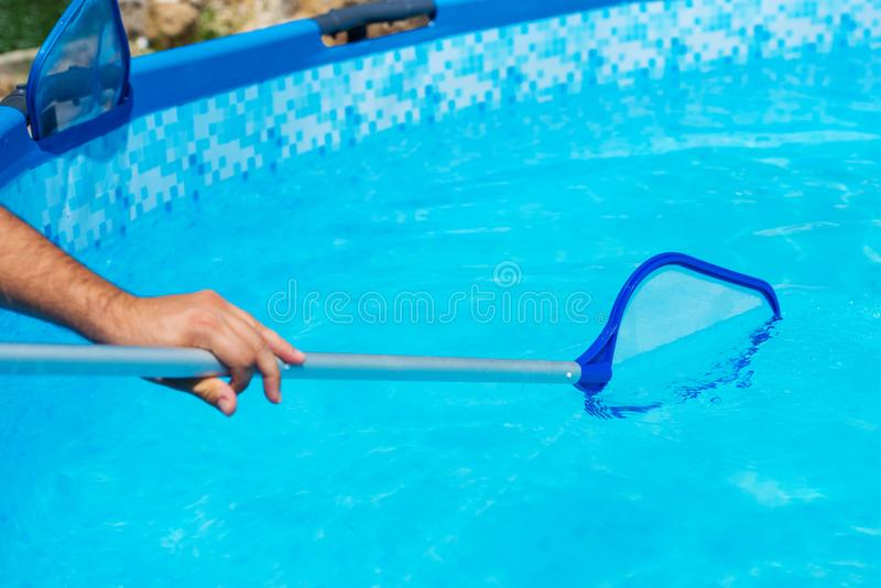 Person cleaning the pool