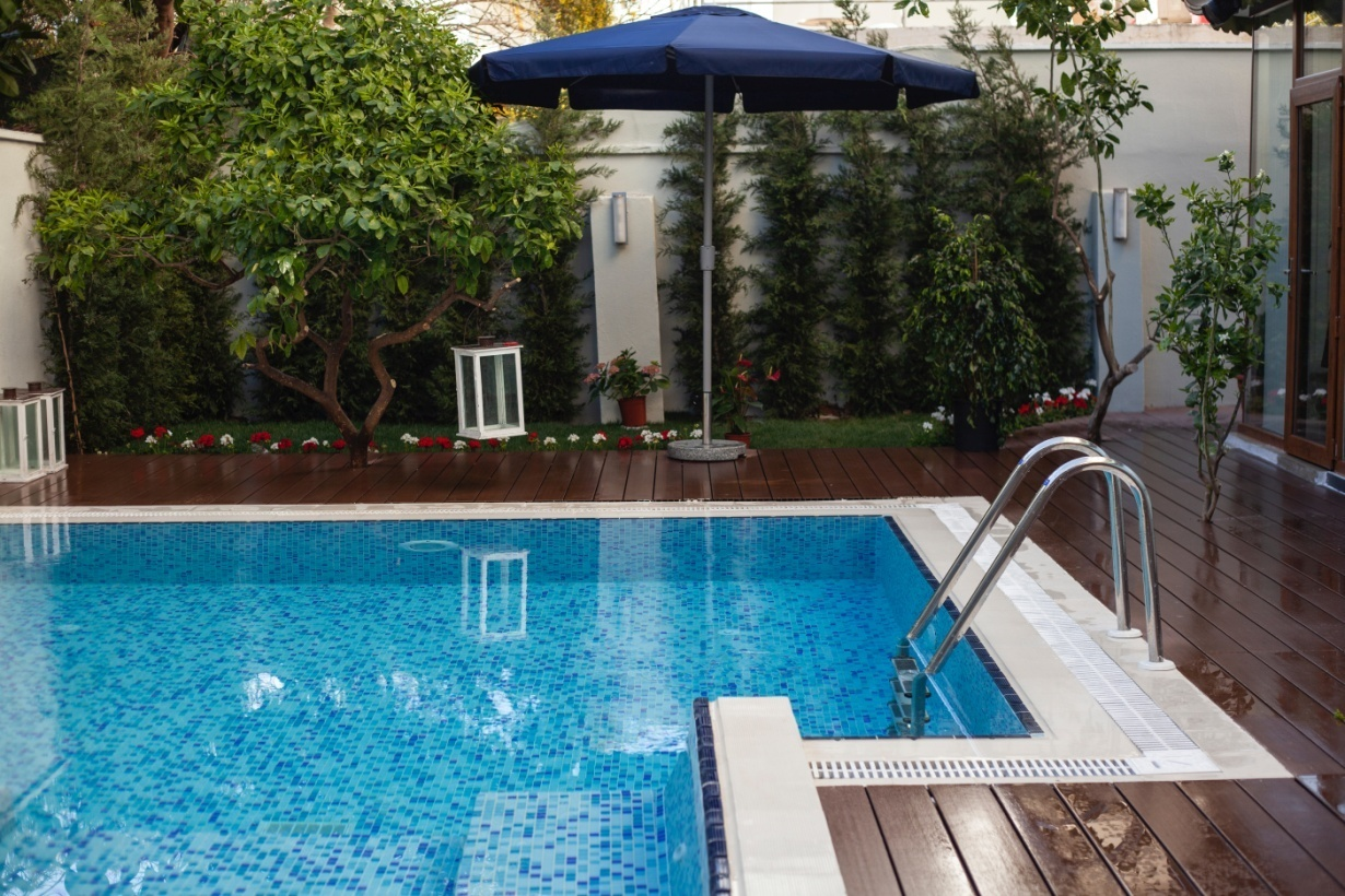 A wooden deck near a swimming pool in Ashburn, VA