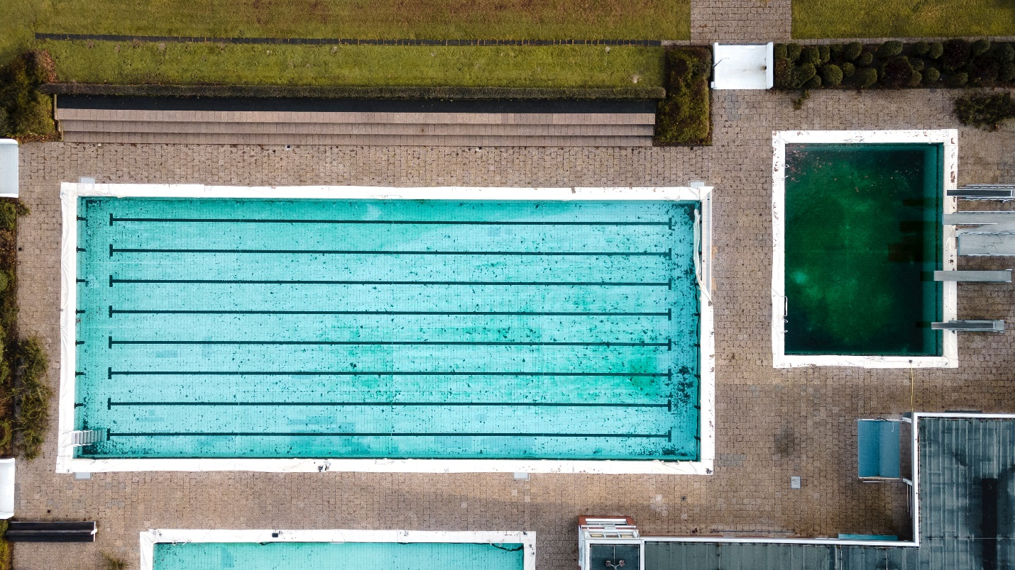 A dirty swimming pool with buildup