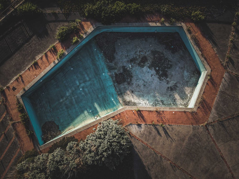Aerial shot of dirty swimming pool