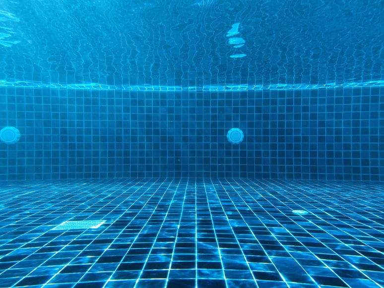 Photo of an underwater view of a swimming pool