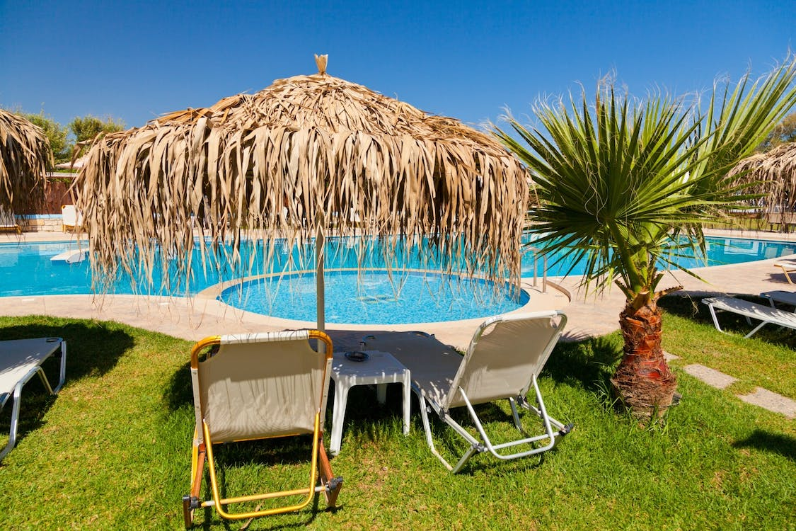 Photo of a beautiful swimming pool with lounge chairs