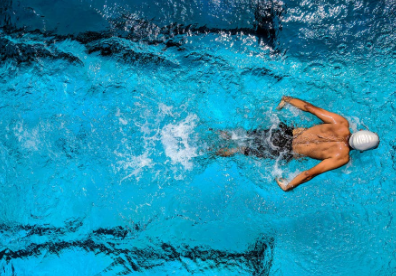 Top view of a person swimming in a pool