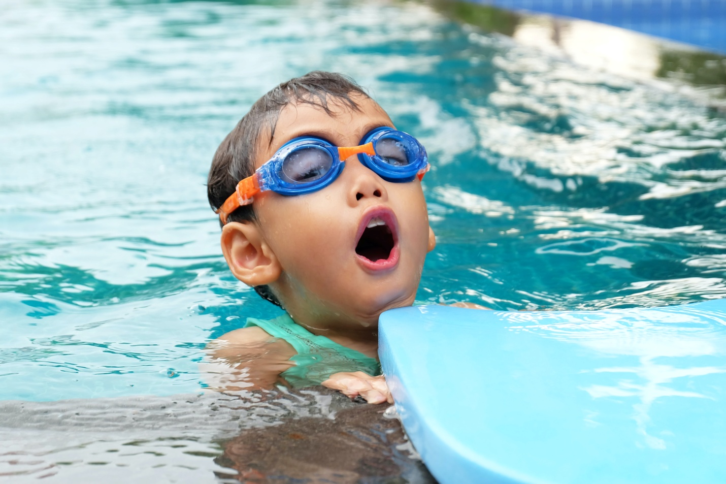 A boy enjoying himself in a swimming pool