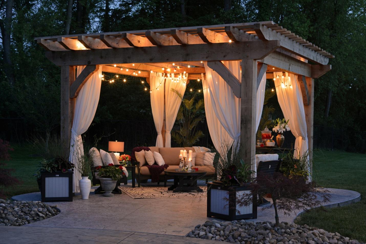 A well-decorated patio with lights and furniture