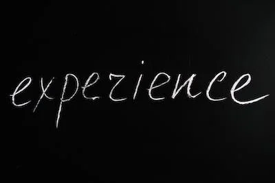 A blackboard with the word experience written on it