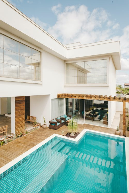 An Aesthetic Pool With A House 